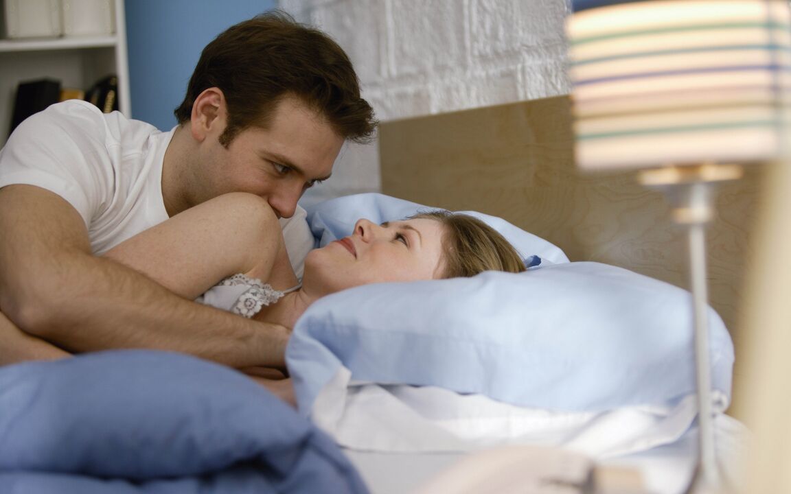 woman in bed with a man with a big penis