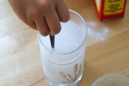 Soda dissolves in the glass